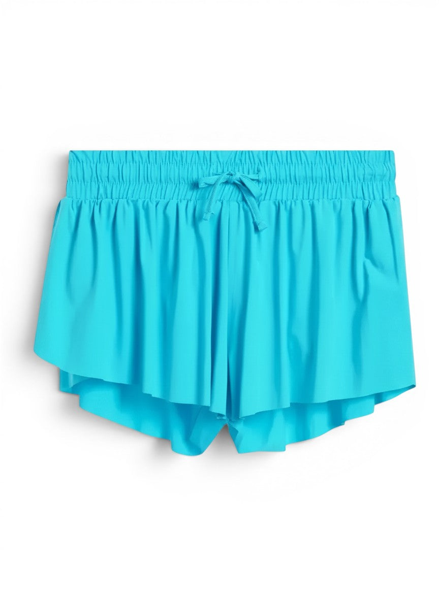 Vann & Liv Capri blue fly away shorts with elastic waistband, drawstring, pleated design, and built-in compression shorts.