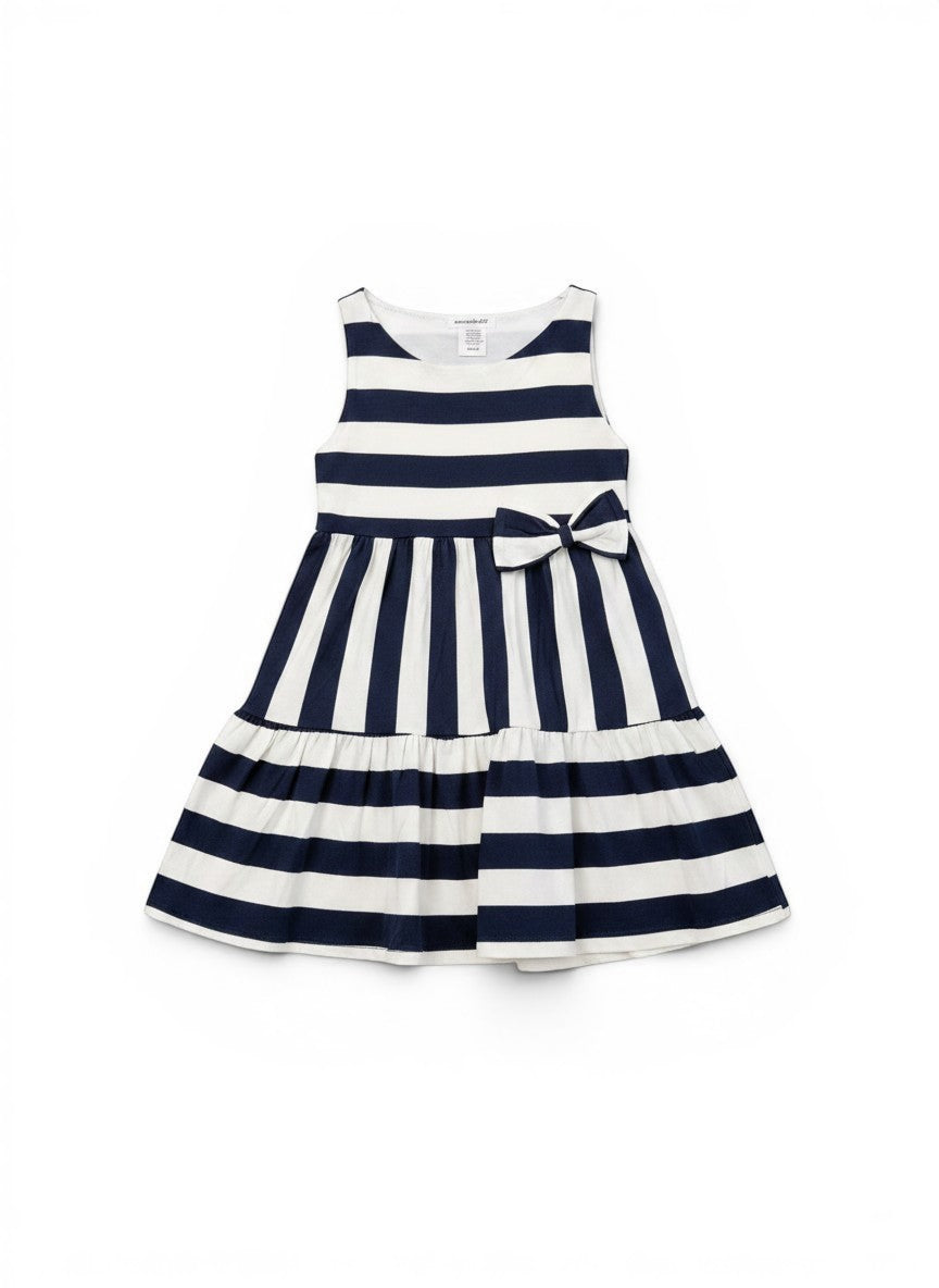 Vann & Liv navy and white striped tiered dress with a bow detail on the front. Sleeveless design, perfect for summer.