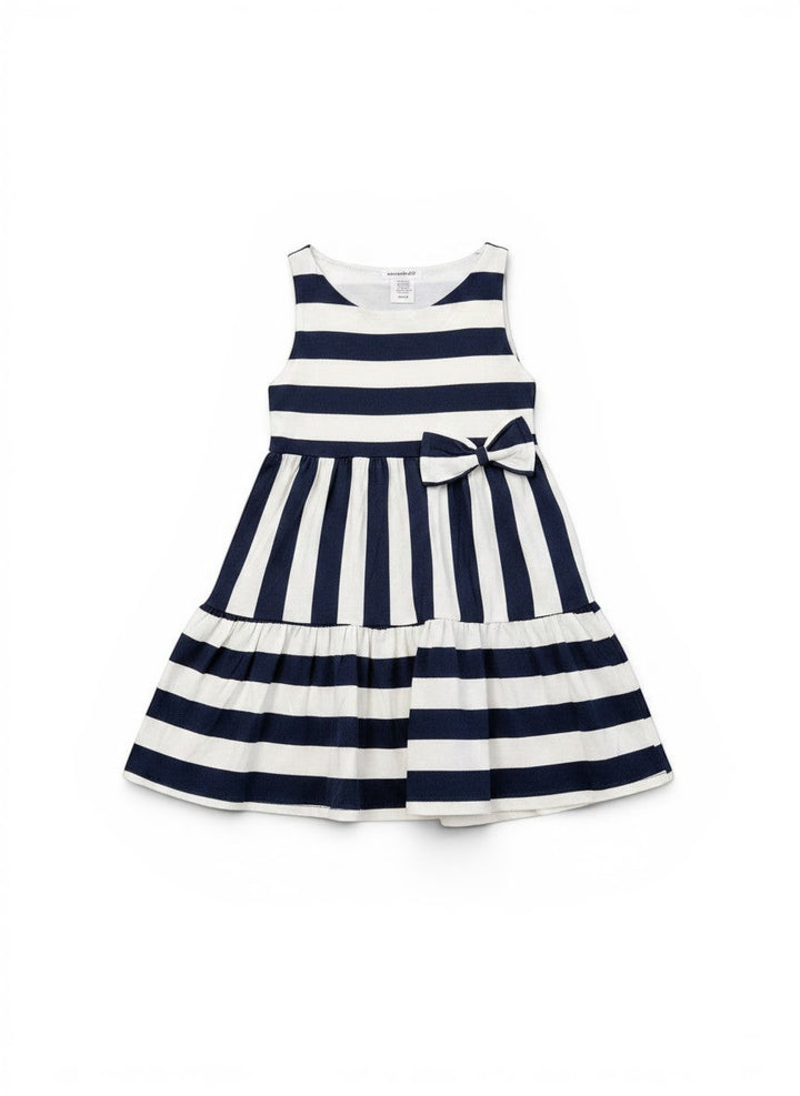 Vann &amp; Liv navy and white striped tiered dress with a bow detail on the front. Sleeveless design, perfect for summer.