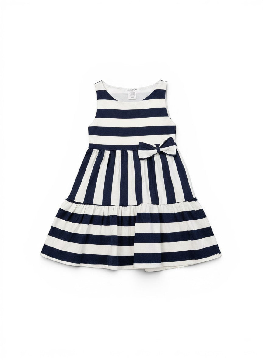 Vann & Liv navy and white striped tiered dress with a bow detail on the front. Sleeveless design, perfect for summer.