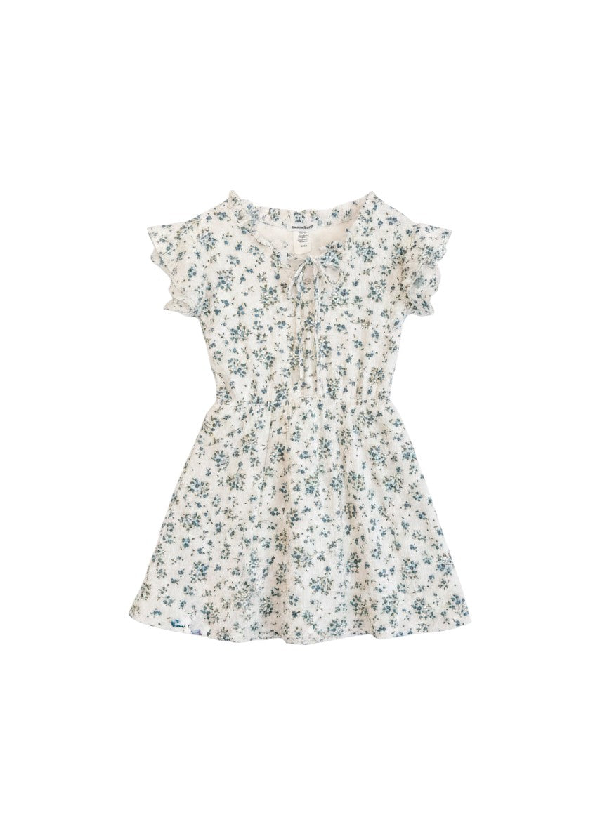 Vann & Liv white dress with blue floral print, ruffle neckline, tie front, and flutter sleeves. Perfect for girls size 7-14.