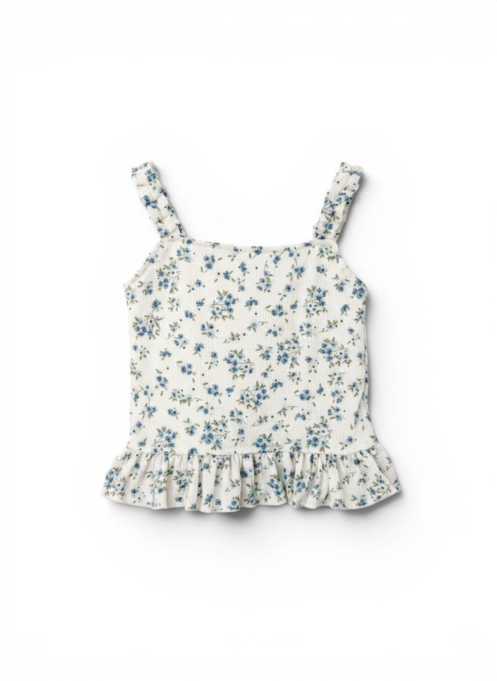 Vann &amp; Liv white floral print ruffle tank top with blue flowers and green leaves, featuring ruffled straps and hem.