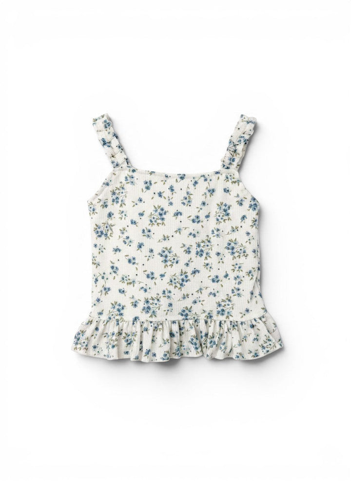 Vann &amp; Liv white floral print ruffle tank top with blue flowers and green leaves, featuring ruffled straps and hem.